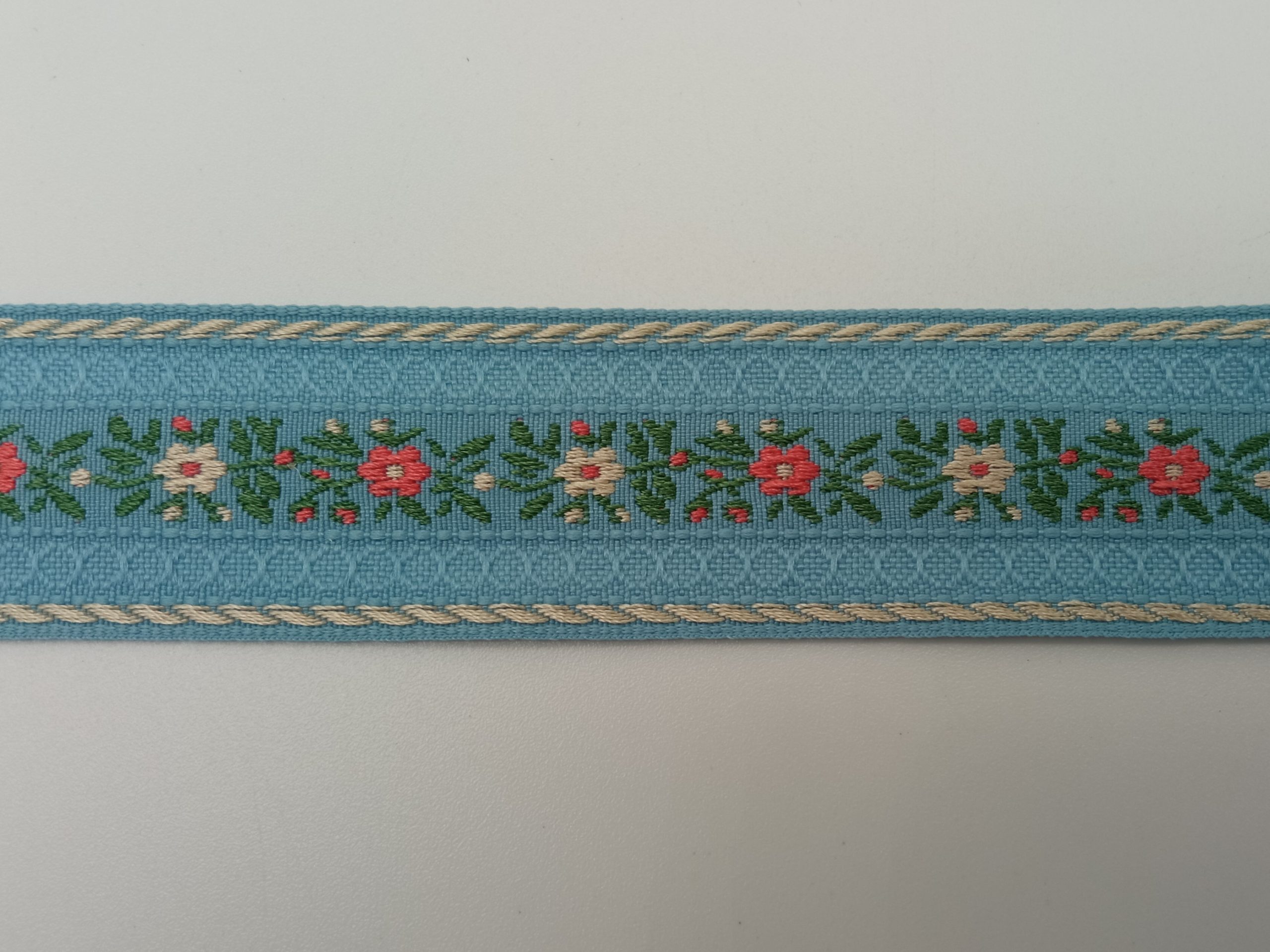 Tapacosturas bordado flores azul